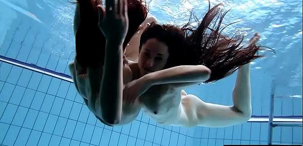  Shaved brunette with big tits underwater